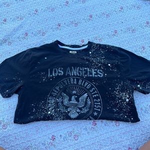 black shirt with white paint splatter